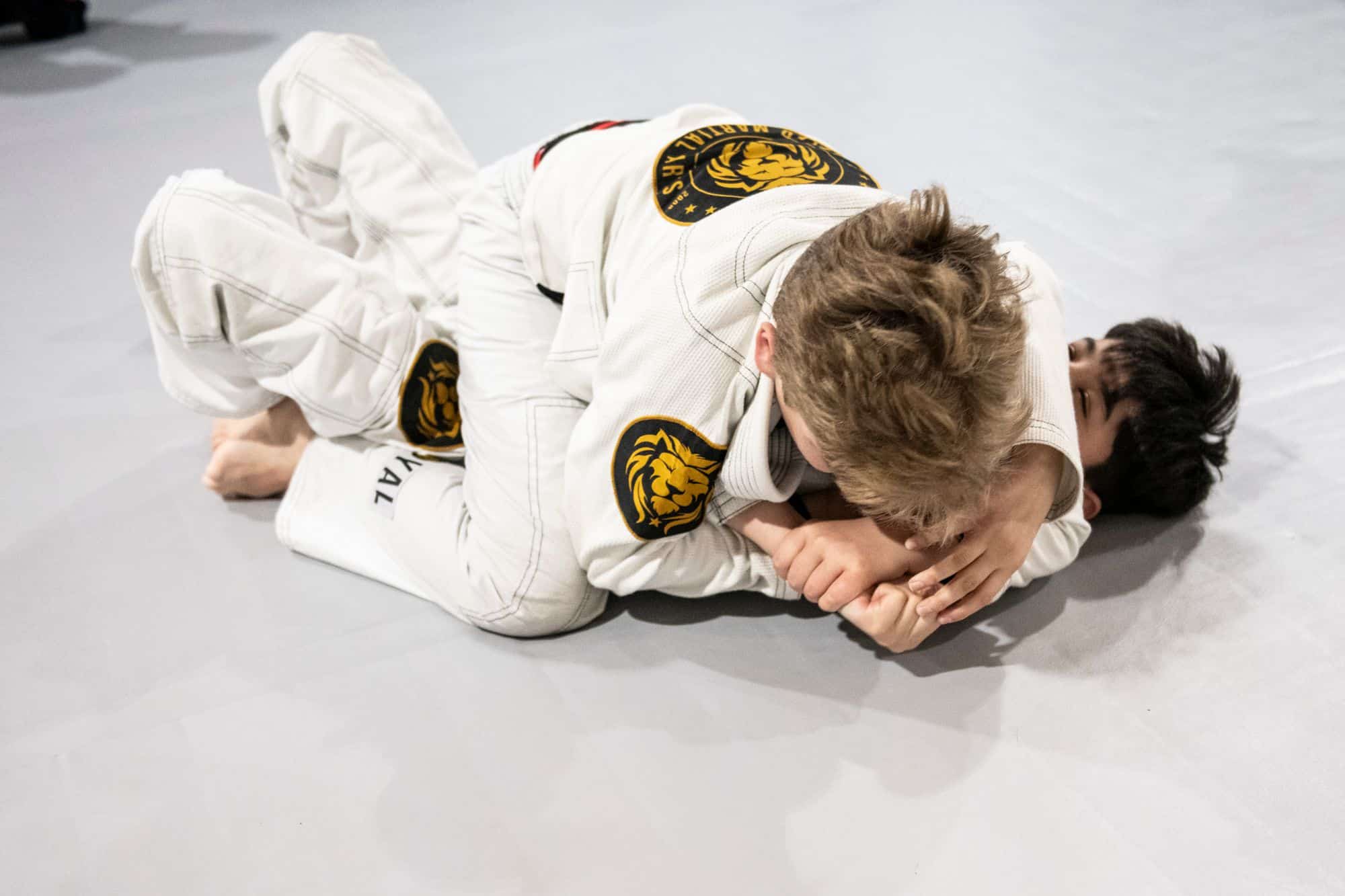 two young kids sparring during kids jiu jitsu class at Royal Mixed Martial Arts