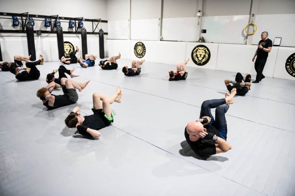 Royal Mixed Martial Arts students warming up before class