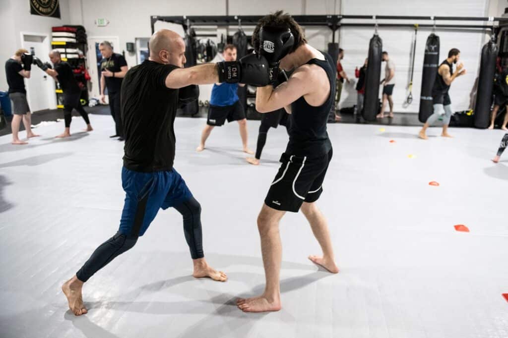 students learning advanced striking and blocking boxing techniques at Royal Mixed Martial Arts boxing classes