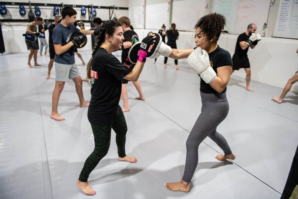 Two women boxing during Royal Mixed Martial Arts Boxing Class for self-defense