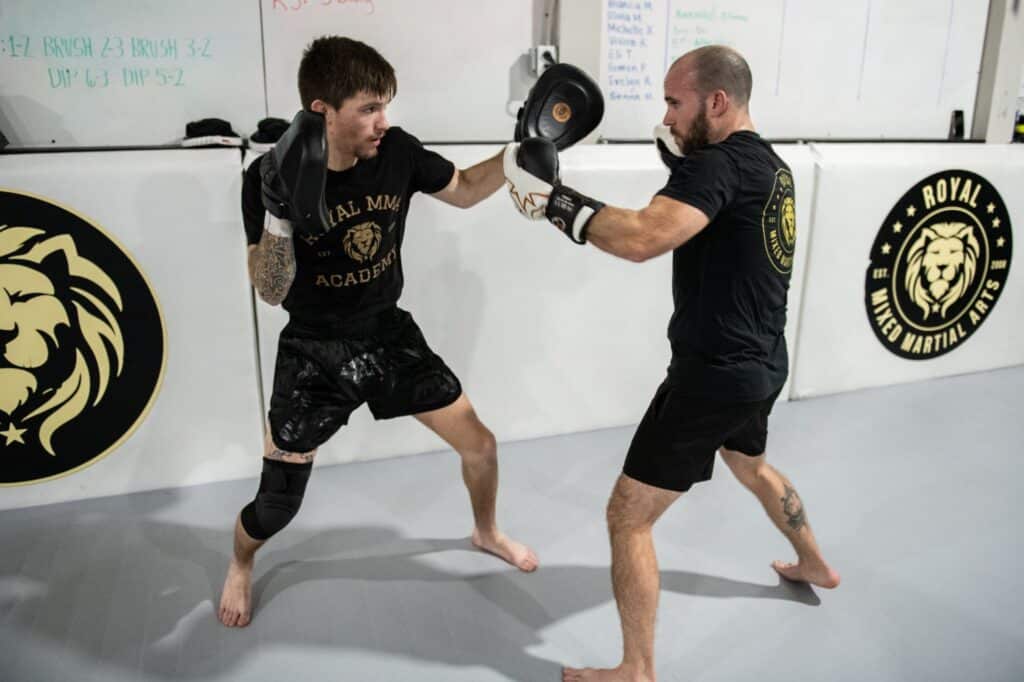 two students practicing hitting techniques for Royal Mixed Martial Arts boxing classes