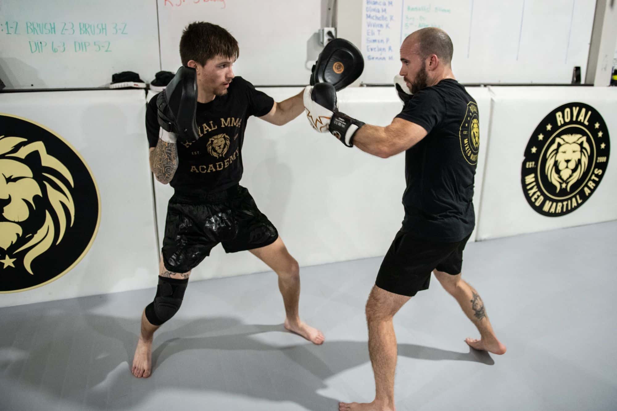 two students practicing hitting techniques for Royal Mixed Martial Arts boxing classes