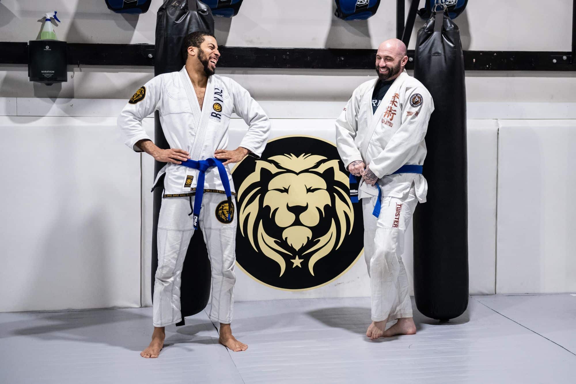 Two students laughing during jiu jitsu class at Royal Mixed Martial Arts