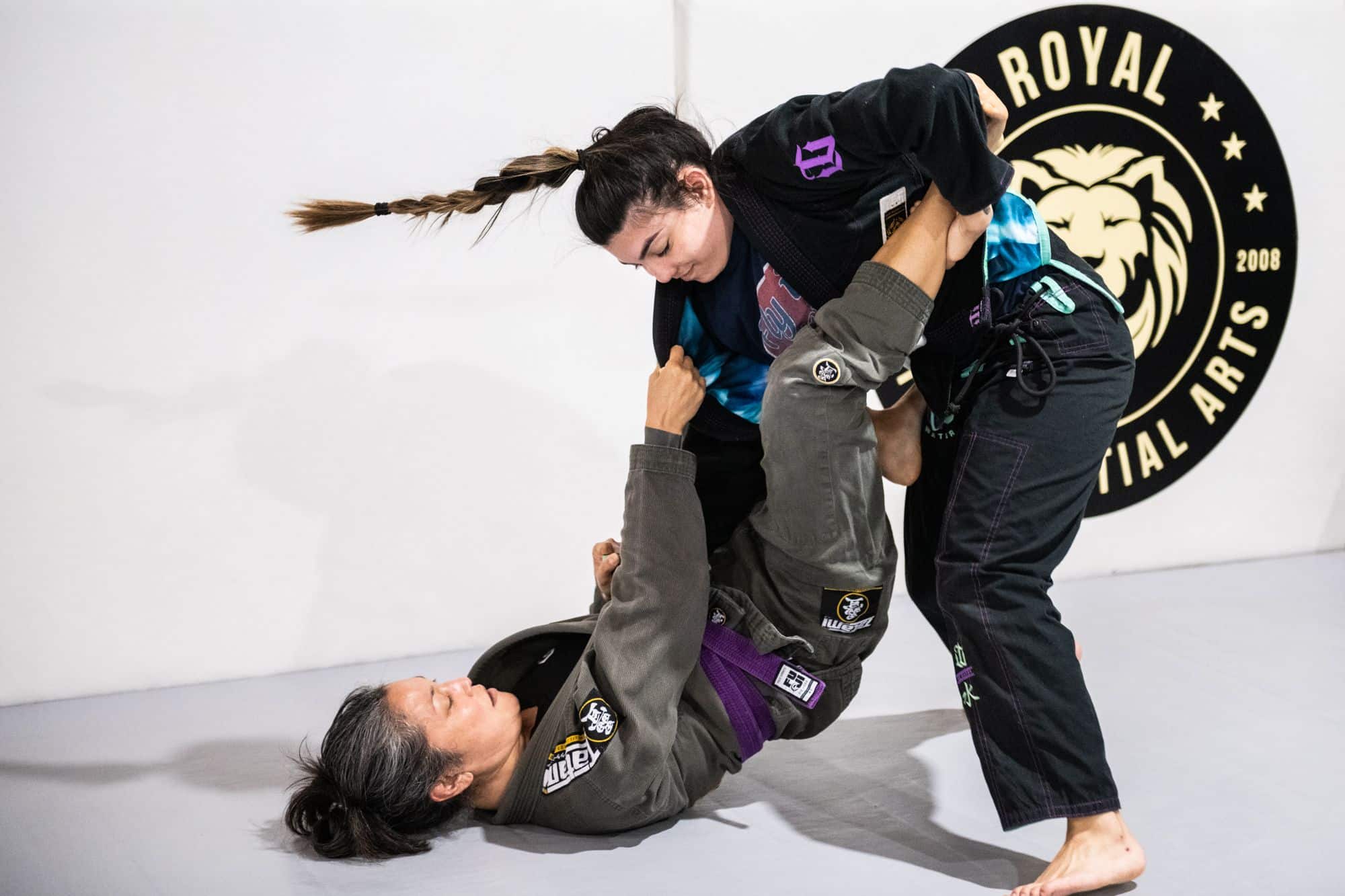 two women at Royal Mixed Martial Arts sparring for jiu jitsu class