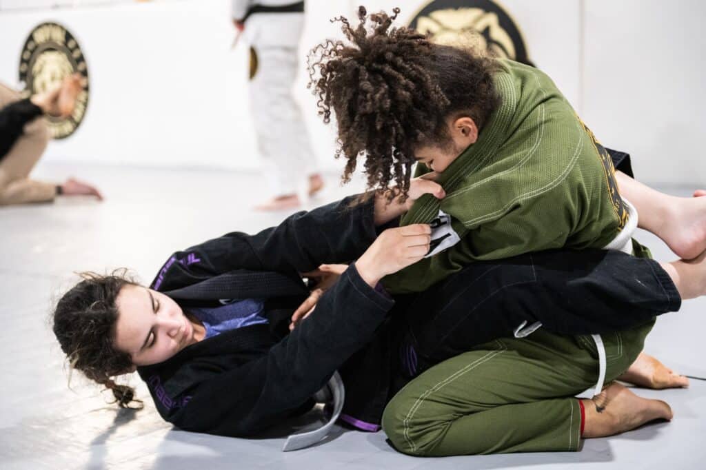 two female students sparring during jiu jitsu class at Royal Mixed Martial Arts