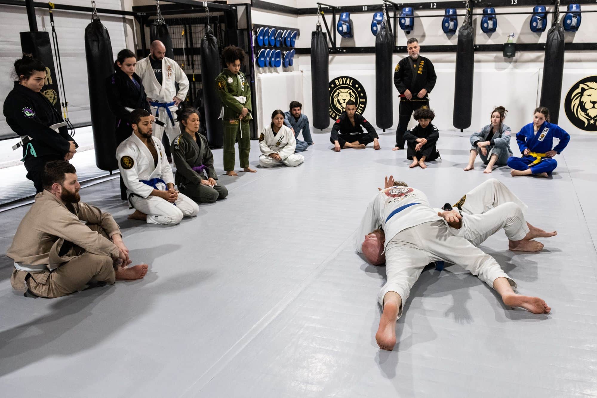 Royal Mixed Martial Arts instructors demonstrating sparring techniques during jiu jitsu class